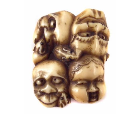 19th century Japanese ivory Netsuke four face masks, height 4.2cm. Unfortunately we are unable to do condition reports and ex