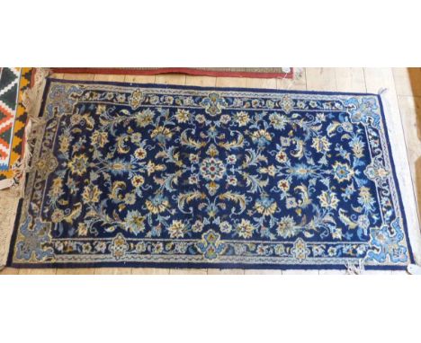 Blue ground Persian style carpet, 140 x 70cm. Unfortunately we are unable to do condition reports and extra images for our In