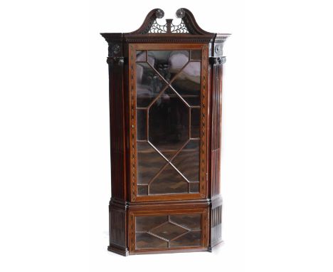 Early 19th century mahogany corner display cabinet, architectural features including swan neck pediment, Corinthian column mo