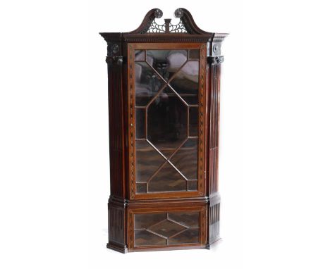 Early 19th century mahogany corner display cabinet, architectural features including swan neck pediment, Corinthian column mo