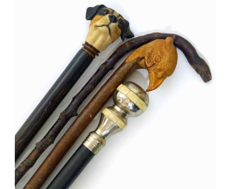 Stan Randel walking stick carved with a pheasant head together with three others. Unfortunately we are unable to do condition