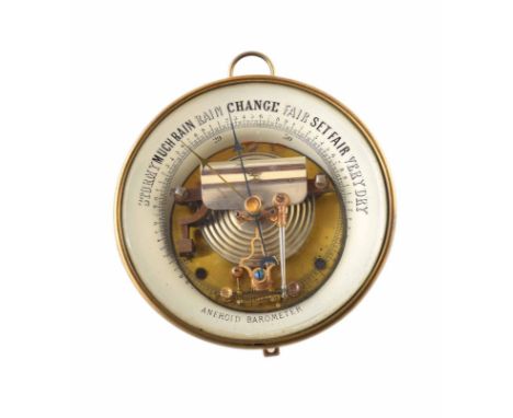 A brass ships aneroid barometer. 17cm; 6.7in diameter. Unfortunately we are unable to do condition reports and extra images f