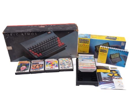 An Oric Atmos 48k Personal Home Computer, serial number 240236, together with instruction booklets in original  packaging, al