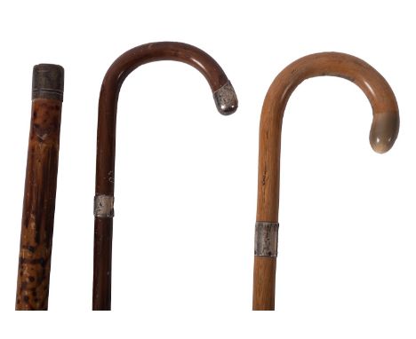 Two silver mounted walking sticks, various makers and dates, together with a brass mounted bamboo and greenheart poachers wal