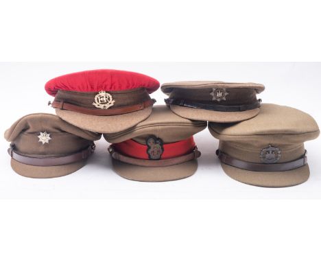 Five British Army peaked caps, Devonshire Regiment, Dorsetshire, Royal Anglian, Royal; Military Police and one other (5) 
