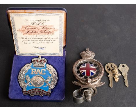 An RAC badge, with enamel Union Jack Centre, together with caser Elizabeth II  RAC Queen's Silver Jubilee Badge, number 772/1