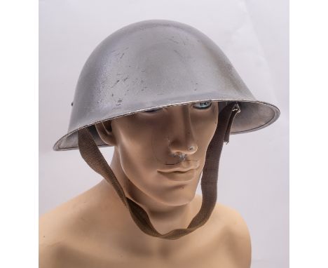 An Italian army steel helmet, with black leather liner, together with a MK.III 'Turtle' steel helmet (2) .