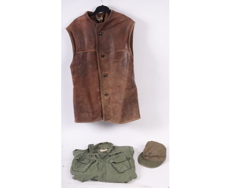 U.S Army Vietnam shirt Combat Tropical, DSA, 100-1387, together with a British Army brown leather jerkin with Ganterie Modern