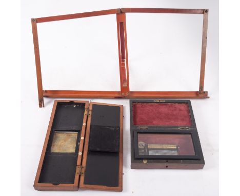 An early 20th century  rosewood music box, playing three airs, 18 x 11 x 6cm, together with a 'Primus Stereoscope Transparenc