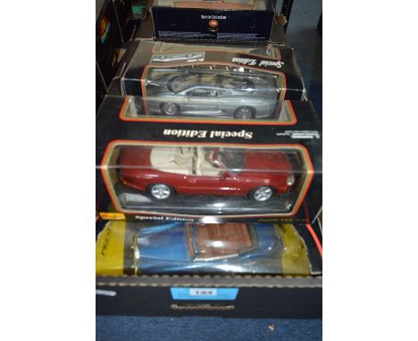 A COLLECTION OF FIVE BOXED 1:18 SCALE MODEL DIECAST CARS, manufactured by Burago, Maisto and Solido. Models are European cars