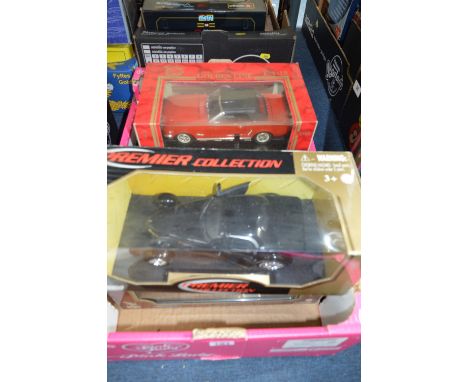 A COLLECTION OF FIVE BOXED 1:18 SCALE MODEL DIECAST CARS, manufactured by Mattel, Motormax, Mira and Burago. Models are Ameri