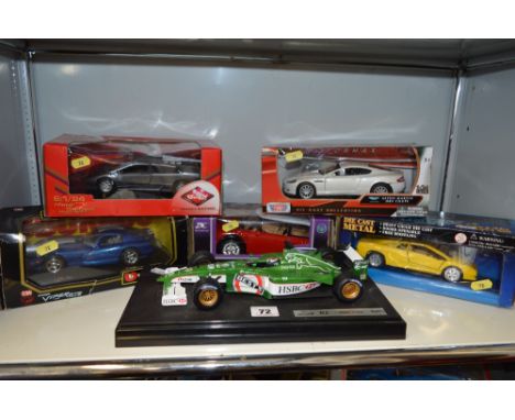 A QUANTITY OF BOXED AND UNBOXED DIECAST CAR MODELS, to include unboxed Mattel Hot Wheels Jaguar R2 F1 car, Burago, Guiloy etc