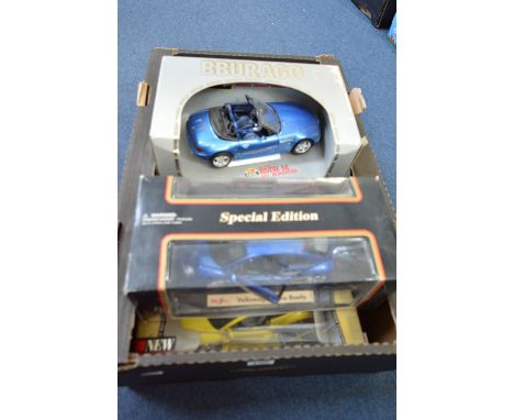 A COLLECTION OF FIVE BOXED 1:18 SCALE MODEL DIECAST CARS, manufactured by Burago and Maisto. Models are European cars