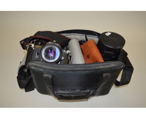 A CAMERA BAG CONTAINING A NIKON M90 SLR CAMERA, fitted with a 50mm 1:1.8 lens, an SB-10 flash, a Hoya HMC 75-280mm 1:4.5 zoom