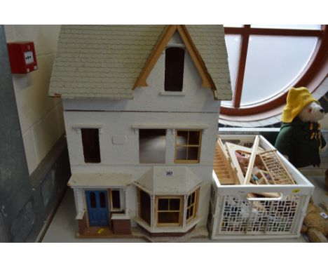 A WOODEN DOLLS HOUSE, in the form of a Victorian/Edwardian villa, front and roof opening to reveal four rooms and landing ove