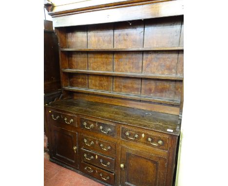 Antique oak and pine North Wales dresser with wide boarded three shelf rack over a base arrangement of six opening drawers an