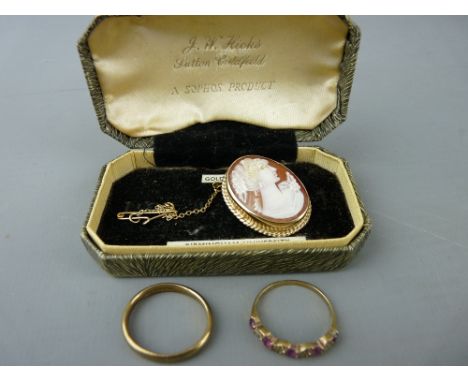 Nine carat gold wedding band, a dress ring with a ruby type leaf setting and a nine carat gold mounted cameo with safety chai