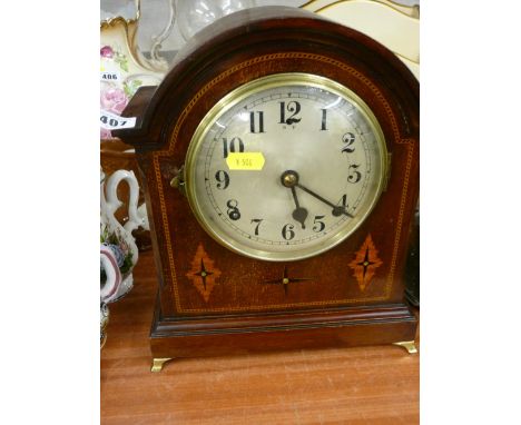 Dome topped inlaid mahogany mantel clock with pendulum and key for a gong chime movement