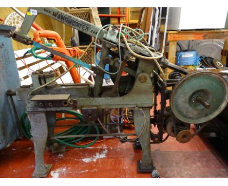 Metal saw bench with embossed title 'New Manchester Saw' E/T