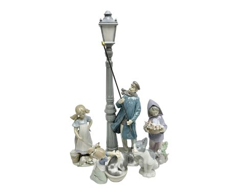 Five Lladro figures, including The Lamp Lighter no 5205,  Girl and Kittens no 6102, Cat no 5113 etcCondition Report:Lamp ligh