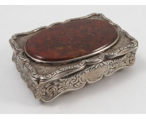 A Victorian silver table snuff box, of shaped rectangular form, the top and base inset with an oval piece of agate, with engr