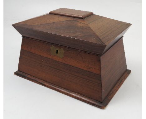 A 19th century rosewood tea caddy, of sarcophagus form, the interior fitted with two covered compartments, width 10.5ins