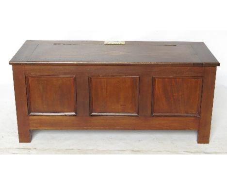 A mahogany coffer, the plain rising lid inset with lozenge shaped oak panel and bearing plaque reading ''From The Duke of Wel
