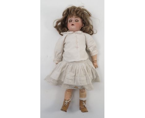 A Simon Halbig bisque headed doll, with sleeping eyes and open mouth, stamped K&R, height 17ins 