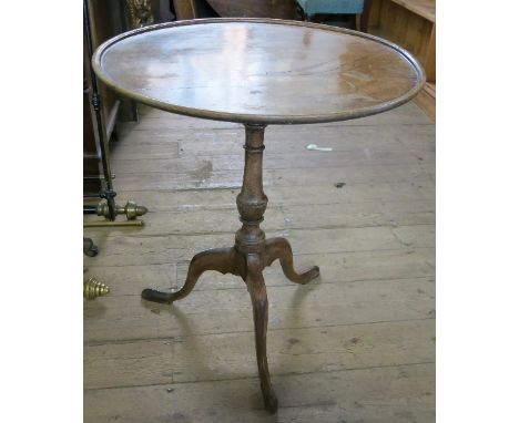 A Georgian mahogany tripod table, the circular dish top raised on a column, terminating in tripod base, width 23.5ins 