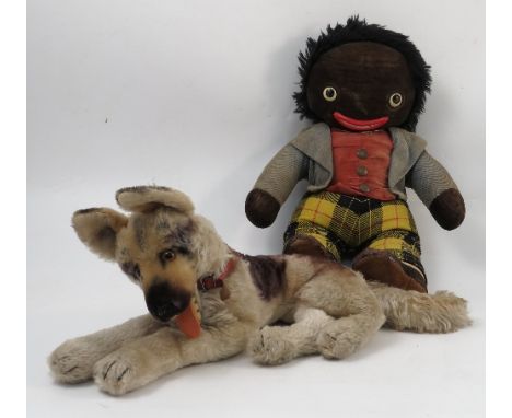 A Steiff plush teddy bear, of an Alsatian dog lying down, lacking button or tag, together with other teddies and a Chad Valle