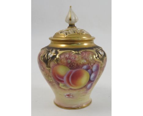 A Royal Worcester covered quarter lobed vase, hand painted to the front with fruit to a mossy background by M Morris, shape n