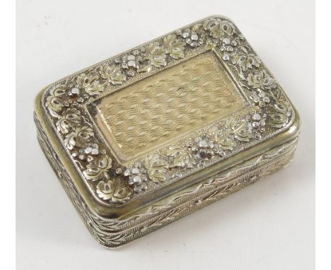 A George III silver gilt vinaigrette, of rectangular form, the lid with raised floral border to engine turned panel, the edge