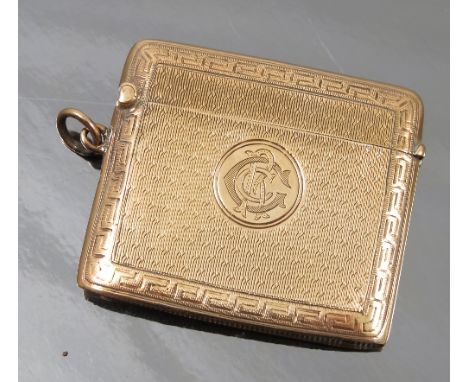 A 9ct gold vesta case, of rectangular form with engine turned decoration and engraved with initials, Birmingham 1894, maker G