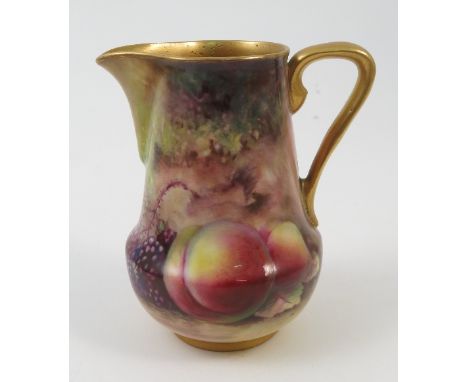 A Royal Worcester miniature milk jug, decorated with hand painted fruit to a mossy background by Lockyer, circa 1920