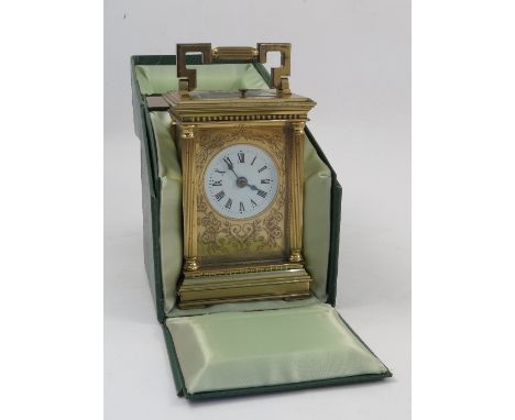 A 20th century Charles Frodsham repeating carriage clock, with white circular dial, Roman numerals to an engraved gilt front,