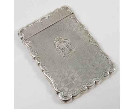 A Victorian silver card case, of shaped rectangular form, with engine turning and initials, Birmingham 1852, weight 2oz