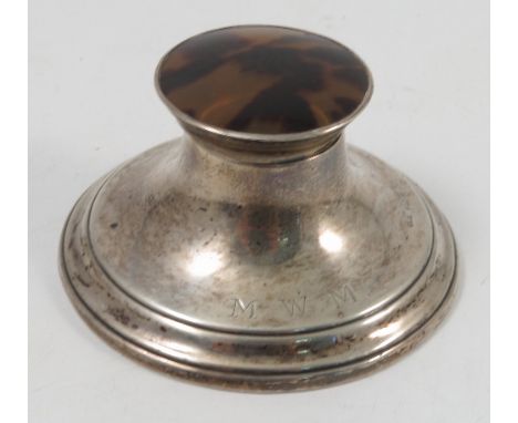 A silver mounted inkwell, of circular form, the hinged cover inset with tortoiseshell, engraved with initials, Birmingham 194