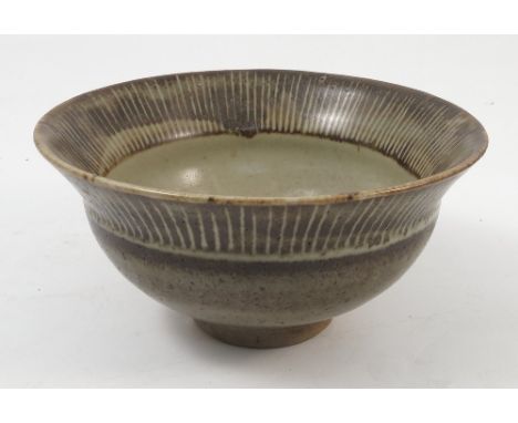 A St Ives David Leach pottery bowl, decorated with lines to the rim, raised on a circular foot, diameter 7.25ins, together wi