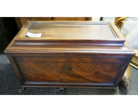 A 19th century mahogany tea caddy, of sarcophagus form, fitted with three compartments, raised on four claw feet, width 13ins
