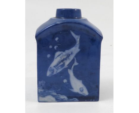 A Royal Worcester Sabrina ware tea caddy, decorated with white fish to a blue ground by W A Austin, shape number 2335, dated 