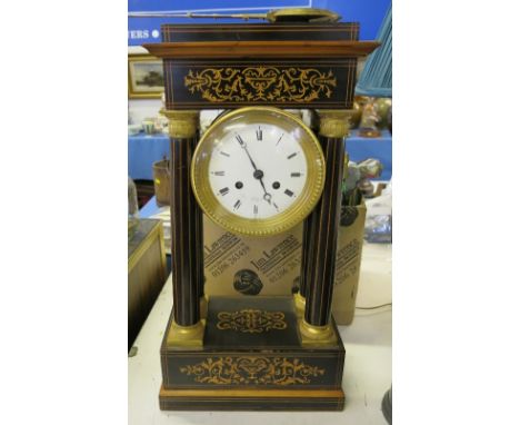 A 19th century French striking mantel clock, of architectural design, with inlaid decoration to the rectangular top, columns 