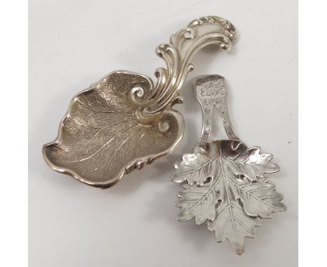 A Georgian silver caddy spoon, the oak leaf bowl with bifurcated handle having bright cut decoration, Birmingham 1821, maker 