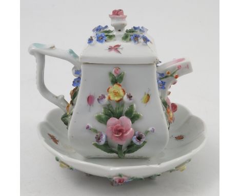 A Continental porcelain encrusted miniature coffee pot and stand, decorated with flowers, blue R to base, height 4.5ins