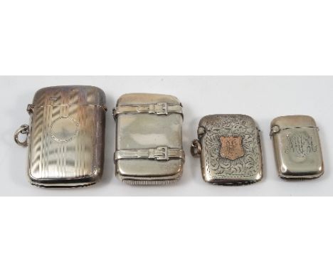 A Victorian silver vesta case, formed as a suitcase with straps, Birmingham 1876, together with another silver vesta case wit