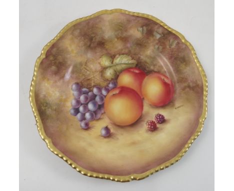 A Royal Worcester cabinet plate, hand painted with fruit to a mossy background by S Weston, to a shaped gilt edge, diameter 1