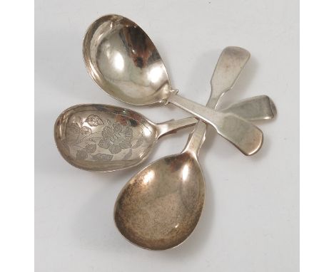 Three Georgian silver fiddle pattern caddy spoons, one engraved with flowers to the bowl, London 1837, 1807 and 1823 