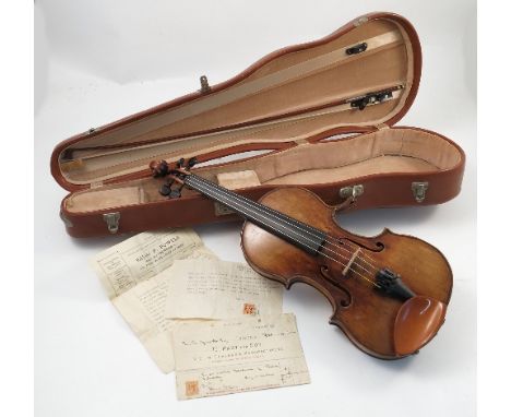 An 18th century Italian violin, from the Tecchler School, with stylized leaf decoration to the single piece back, length incl