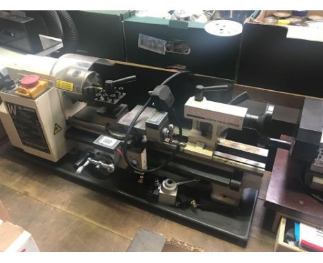 AXMINSTER SIEG C2A, 300 MINI LATHE WITH 3 JAW CHUCK, 2 SETS OF JAWS EMERGENCY STOP, SOME TOOLS