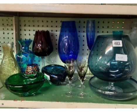 SHELF OF COLOURED GLASSWARE