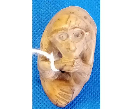 CARVED HARD STONE JAPANESE NETSUKE IN THE FORM OF A MONKEY